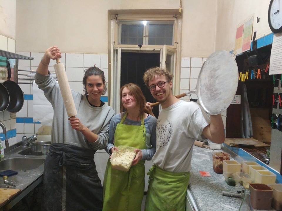 A part of the team kidding in the kitchen